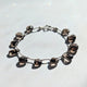 Earthy-toned smokey quartz bracelet designed for November birthstone lovers and boho fashion enthusiasts.