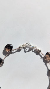 Minimalist November birthstone bracelet in natural light, highlighting sterling silver accents.