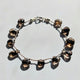 Handmade boho chic smokey quartz bracelet showcasing translucent brown gemstone drops.