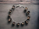 Smokey quartz bracelet arranged in a circle, highlighting the smooth teardrop gemstones.